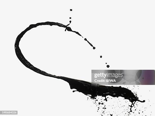 liquid splashing in midair - black liquid stock pictures, royalty-free photos & images