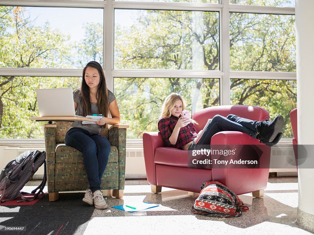 Young women studying for college classes