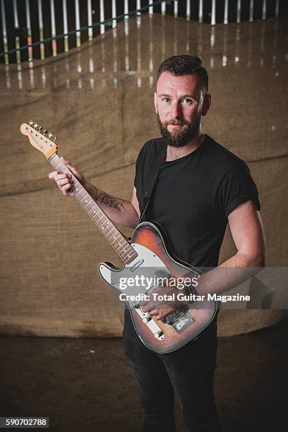 Portrait of English musician Tim Walters, guitarist with math rock group Poly-Math, photographed backstage at ArcTanGent Festival in Somerset, on...