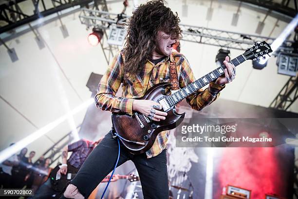 Guitarist and vocalist Thomas Erak of American hard rock group The Fall Of Troy performing live on stage at ArcTanGent Festival in Somerset, on...
