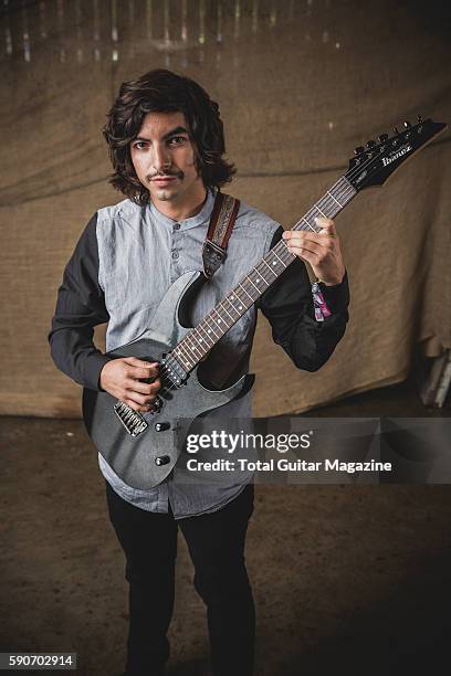 Portrait of American musician Mario Camarena, guitarist with progressive rock group Chon, photographed backstage at ArcTanGent Festival in Somerset,...