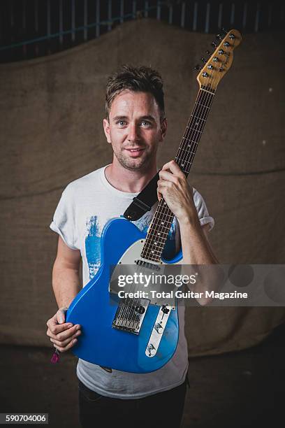 Portrait of musician Paul Russell, guitarist with instrumental rock group Axes, photographed backstage at ArcTanGent Festival in Somerset, on August...