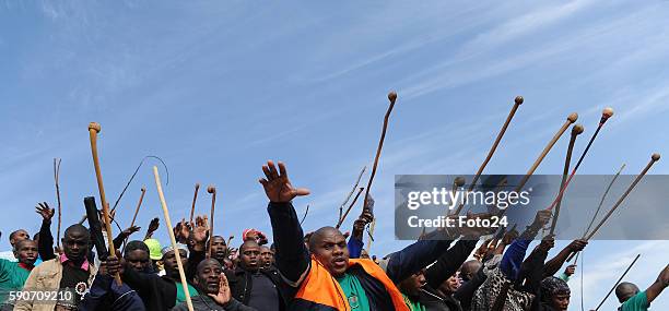 Miners sing and dance during the commemoration of the 2012 Marikana massacre on August 16 2016 in Rustenburg, South Africa. August 16, 2016 marks...