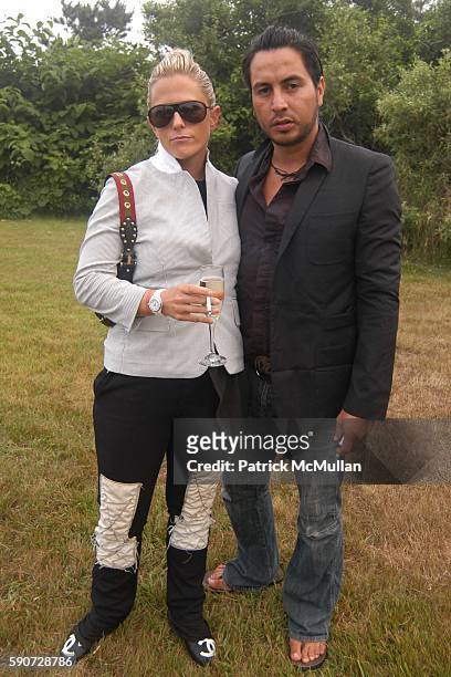 Kim Mile and Gabriel Rey attend Junko Yoshioka Presents Her Evening Wear Collection at Peter and Nejma Beard Residence on July 16, 2005 in Montauk,...