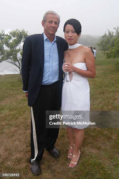 Peter Beard and Junko Yoshioka attend Junko Yoshioka Presents Her Evening Wear Collection at Peter and Nejma Beard Residence on July 16, 2005 in...