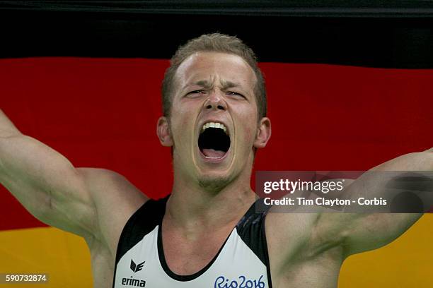 Gymnastics - Olympics: Day 11 Fabian Hambuechen of Germany celebrates after winning the gold medal in the Men's Horizontal Bar Final during the...