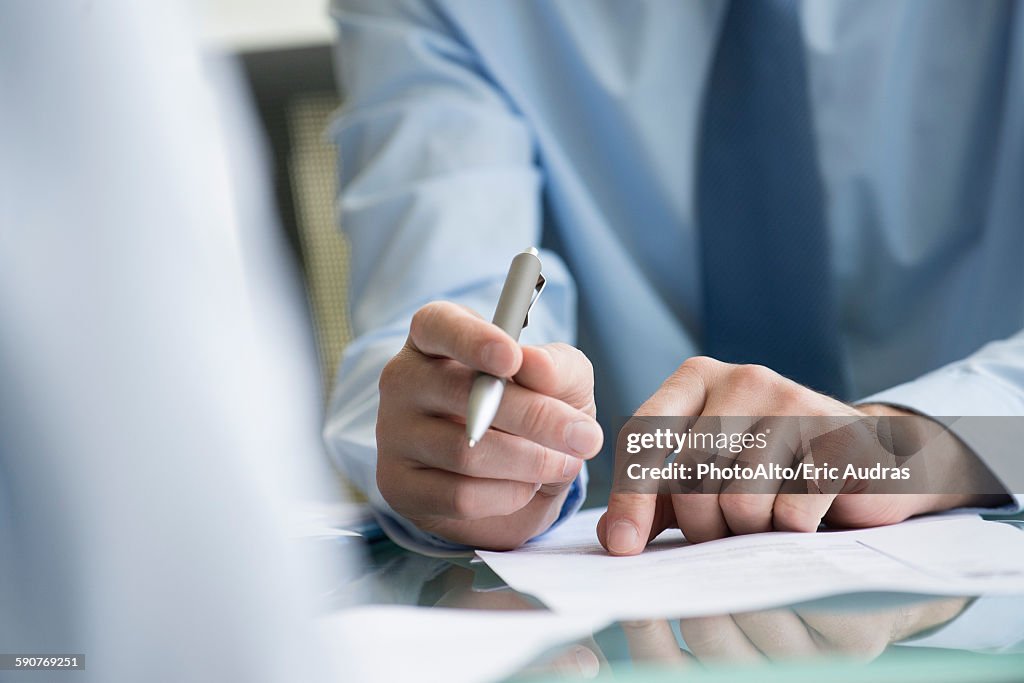 Lawyer reviewing document with client