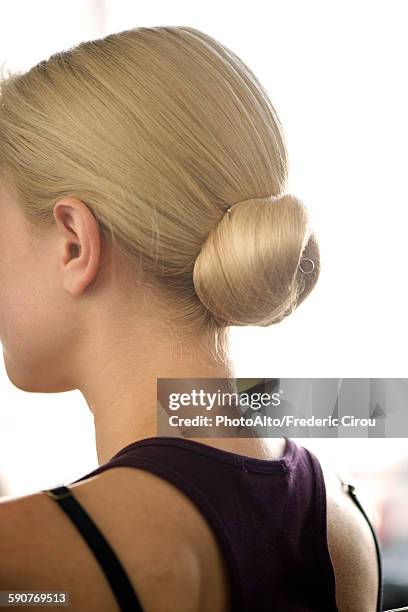 woman with hair arranged in a chignon - bun hair woman stock pictures, royalty-free photos & images