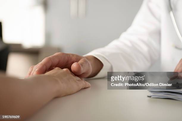 sexual harrassment in healthcare workplace - consoling hands stock pictures, royalty-free photos & images