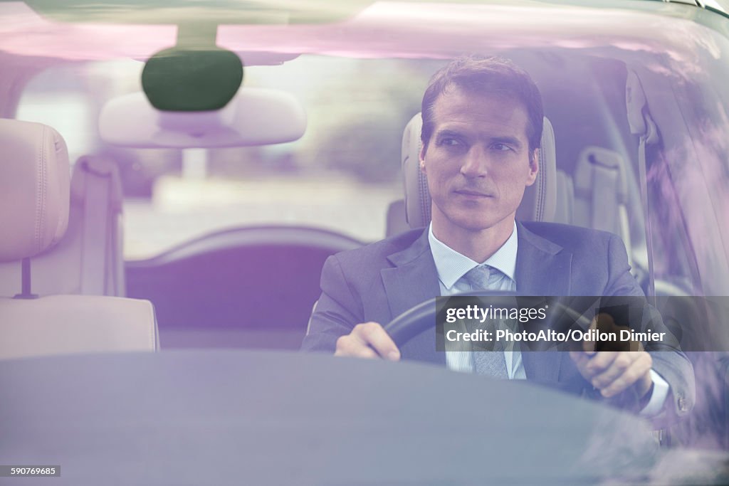 Man driving car without passengers