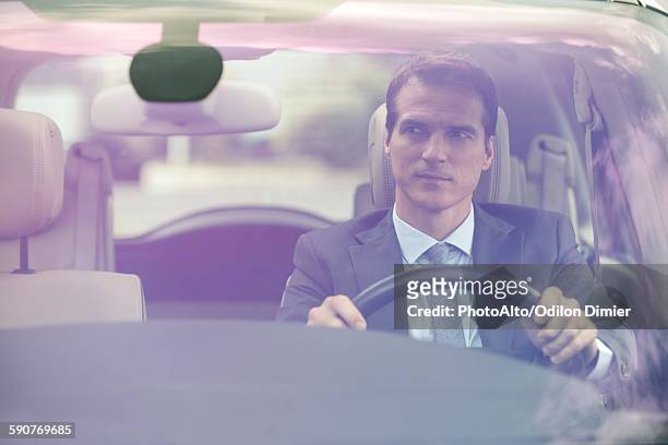 man driving car without passengers - man front view stock pictures, royalty-free photos & images