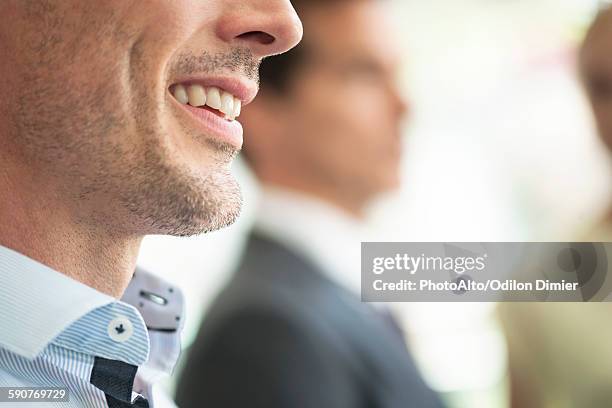 businessman smiling, close-up - menschlicher mund stock-fotos und bilder