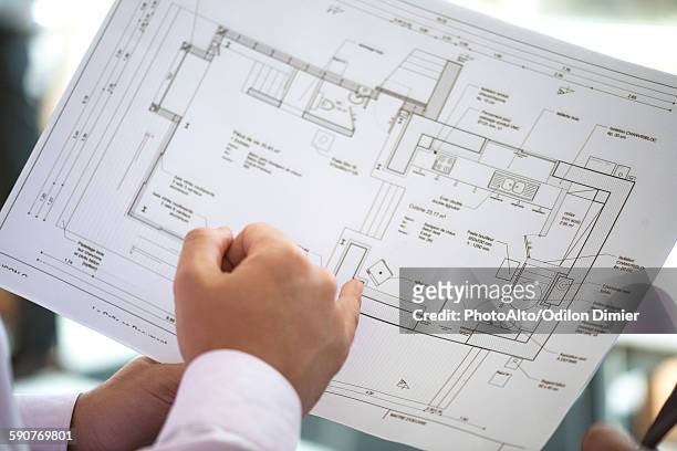 businessman holding blueprint, close-up - planalto stock pictures, royalty-free photos & images