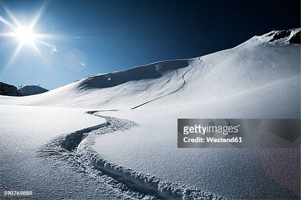 austria, tyrol, ischgl, ski tracks in powder snow - イシュグル ストックフォトと画像