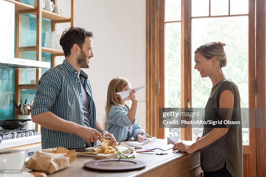 Family spending time together in kitchen