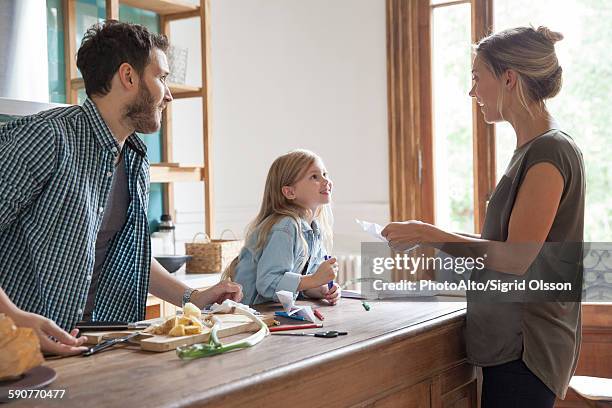 family spending time together in kitchen - dice drawing stock pictures, royalty-free photos & images