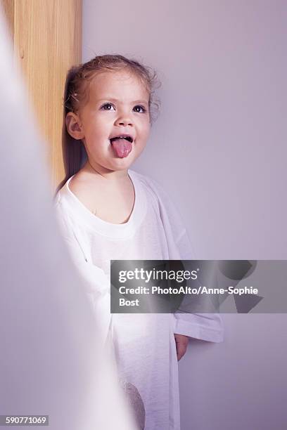 little girl sticking out her tongue, portrait - sticking out tongue stock pictures, royalty-free photos & images