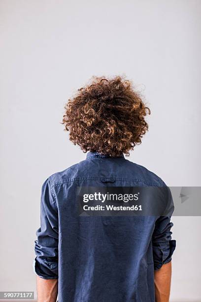 back view of man with curly hair - men curly hairstyles stock pictures, royalty-free photos & images