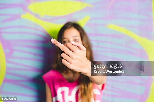 young girl giving the finger - kid middle finger imagens e fotografias de stock