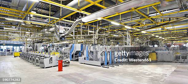 machines for transport and packaging in a printing shop - modern factory stock pictures, royalty-free photos & images