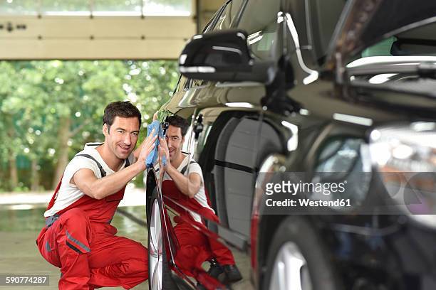 man polishing car - shiny car stock pictures, royalty-free photos & images