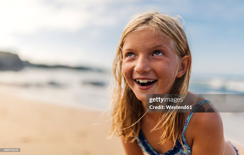 Portrait Of Smiling Blond Girl On The Beach High Res Stock Photo portrait-of-smiling-blond-girl-on-the-beach-high-res-stock-photo