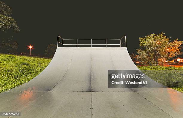 spain, galicia, ferrol, skatepark at night outdoors - skateboarding half pipe stock pictures, royalty-free photos & images