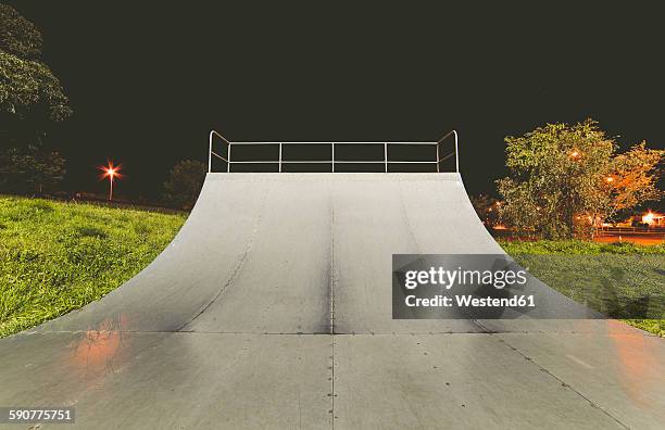 spain, galicia, ferrol, skatepark at night outdoors - halfpipe imagens e fotografias de stock