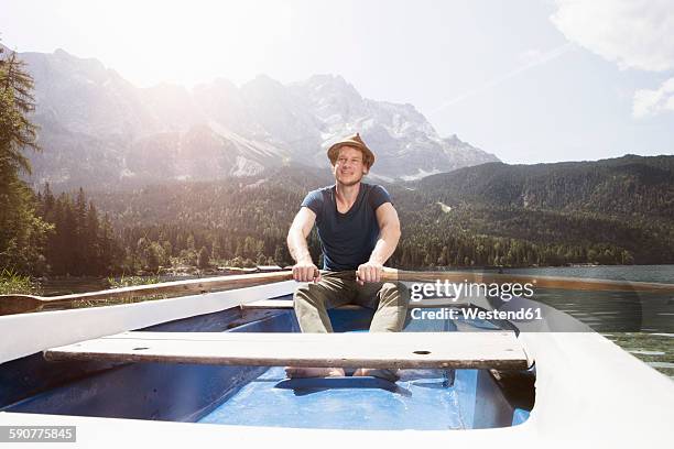 germany, bavaria, eibsee, man in rowing boat on the lake - rowboat bildbanksfoton och bilder