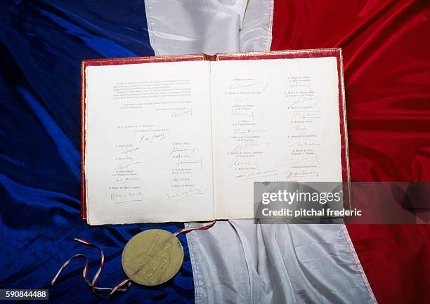 Original text of the Constitution from the 5th French Republic approved by referendum in 1958 and housed at the Chancellery in Paris, alongside an...