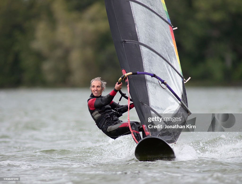 Eighty-year old wind surfer.