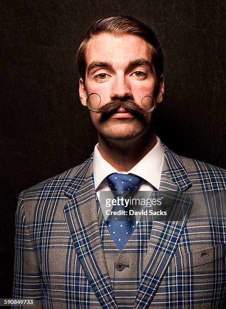 professional beard competitor - men doing quirky things stock-fotos und bilder