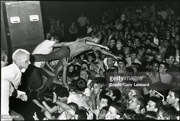 Punks Stage Diving at Night Club Concert