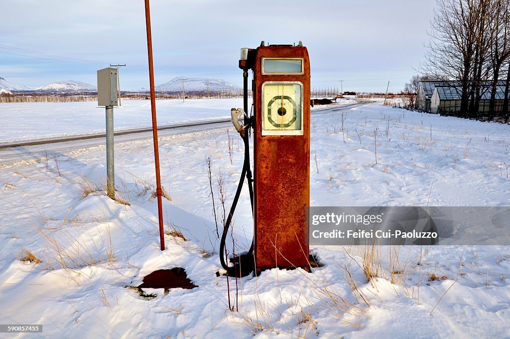 Abandoned fuel pump in winter near Selfoss Iceland