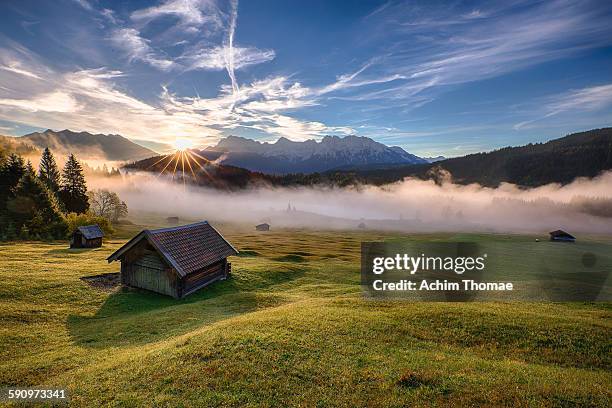 misty morning in bavaria - karwendel mountains stockfoto's en -beelden