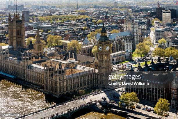 the palace of westminster is the meeting place of the house of commons and the house of lords, the t - portcullis house stock pictures, royalty-free photos & images