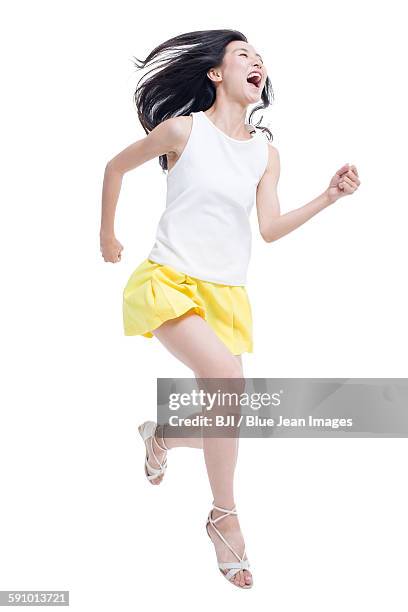 young woman running - causal dress stock pictures, royalty-free photos & images