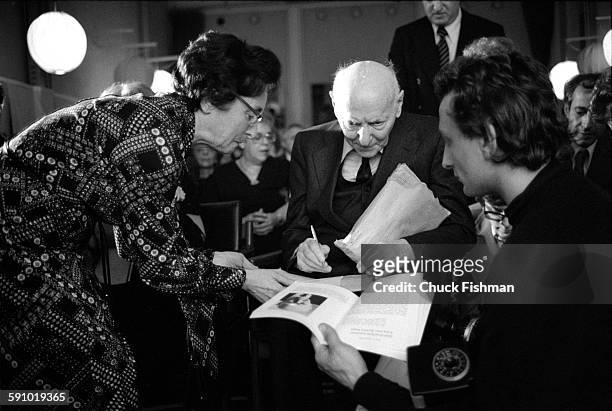 Polish-born American author Isaac Bashevis Singer signs autographs at a reception hosted by members of the local Jewish community, Stockholm, Sweden,...