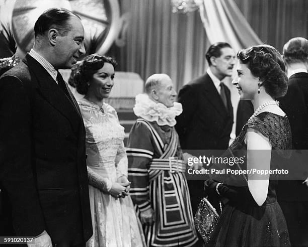 Queen Elizabeth II meets actors Bill Fraser and Pat Kirkwood during her tour of the BBC television Studios at Lime Grove in West London on October...