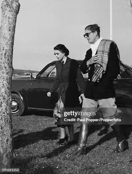 Princess Elizabeth and Prince Philip, Duke of Edinburgh, both pictured wearing sunglasses as they leave the Rome Polo Club grounds after the Duke...