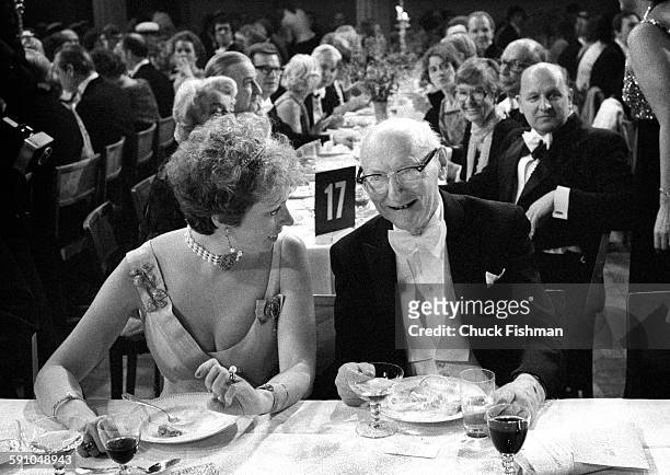 Swedish Princess Christina, Mrs Magnuson shares a laugh with Polish-born American author Isaac Bashevis Singer at the Nobel Prize ceremony banquet,...