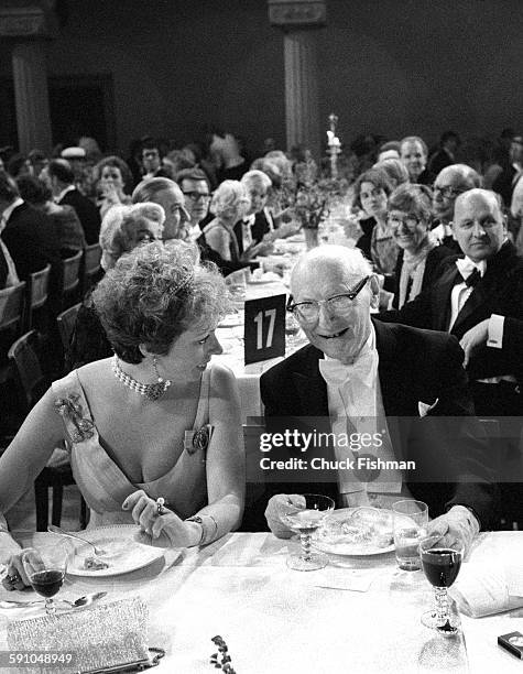 Swedish Princess Christina, Mrs Magnuson shares a laugh with Polish-born American author Isaac Bashevis Singer at the Nobel Prize ceremony banquet,...