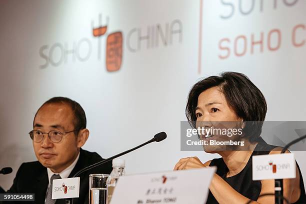 Zhang Xin, chief executive officer of Soho China Ltd., right, speaks as Pan Shiyi, chairman of Soho China Ltd., looks on during a news conference in...
