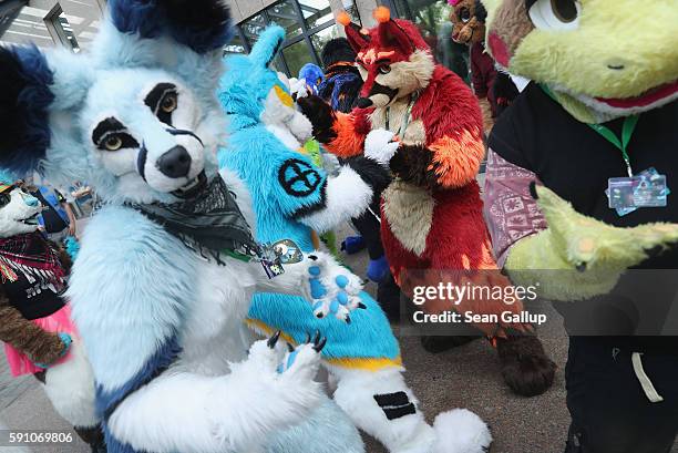 Participants, or furries, as they prefer to be called, dance to flashmob tunes upon their arrival the Estrel Hotel for the 2016 Eurofurence furries...