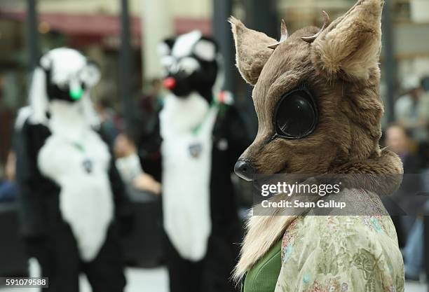 Participants, or furries, as they prefer to be called, mingle upon their arrival at the Estrel Hotel for the 2016 Eurofurence furries gathering on...