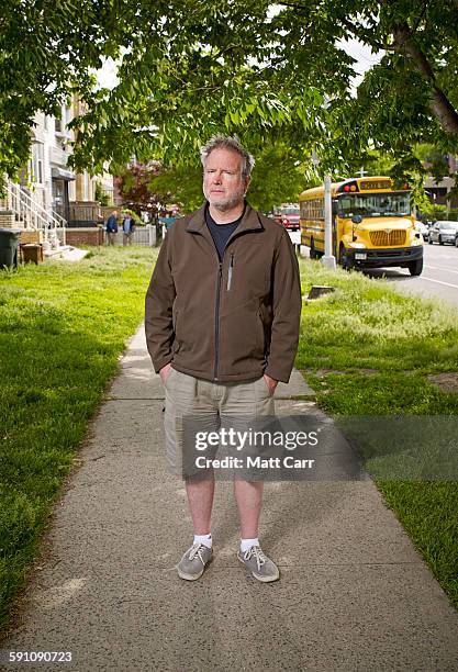 man standing on sidewalk - sapato cor de creme - fotografias e filmes do acervo