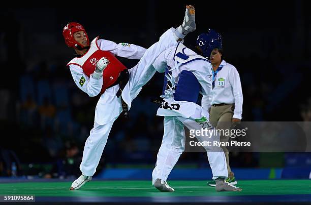 Venilton Teixeira of Brazil kicks Ron Atias of Israel during the Taekwondo Men's -58kg Round One contest on Day 11 of the Rio 2016 Olympic Games at...