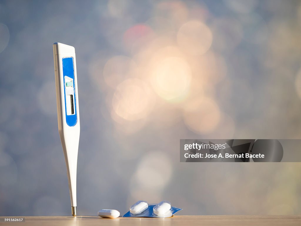 Digital thermometer and pills