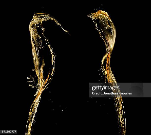 pour of beer against black background - beer liquid stock pictures, royalty-free photos & images