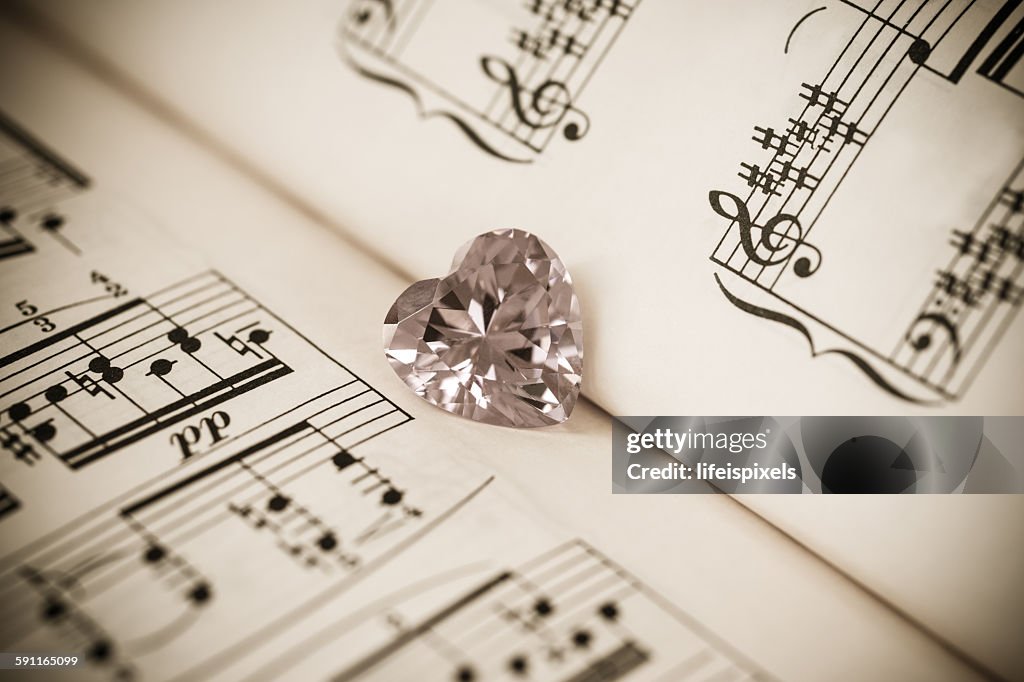 Heart shaped cubic zirconia & music sheet